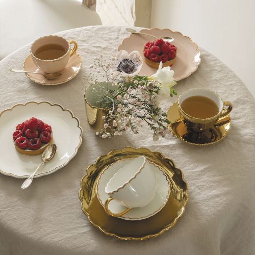Taza dorada con platito “Marguerite”